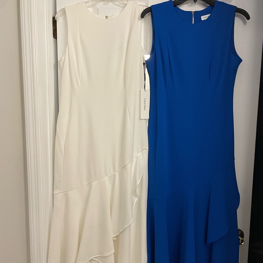 Two Calvin Klein sleeveless mid-length dresses. 94% polyester and 6% spandex.